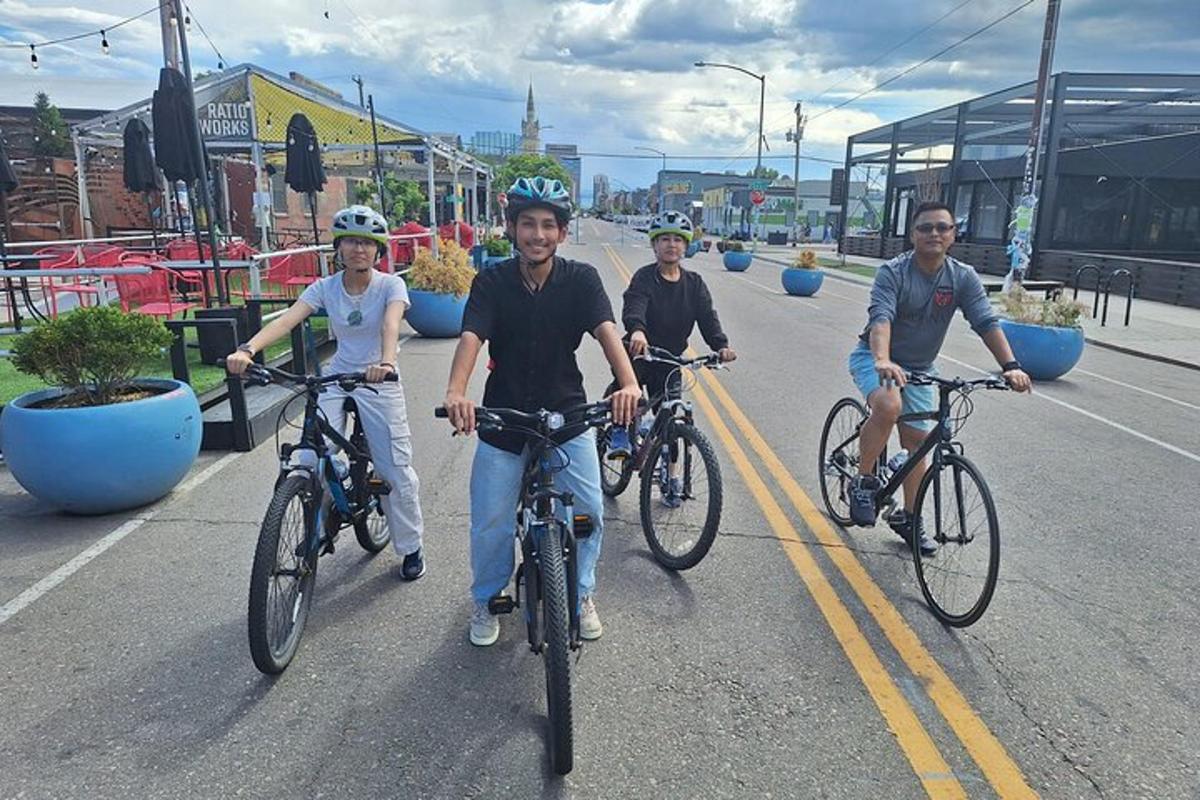 a group of people riding bikes down a street