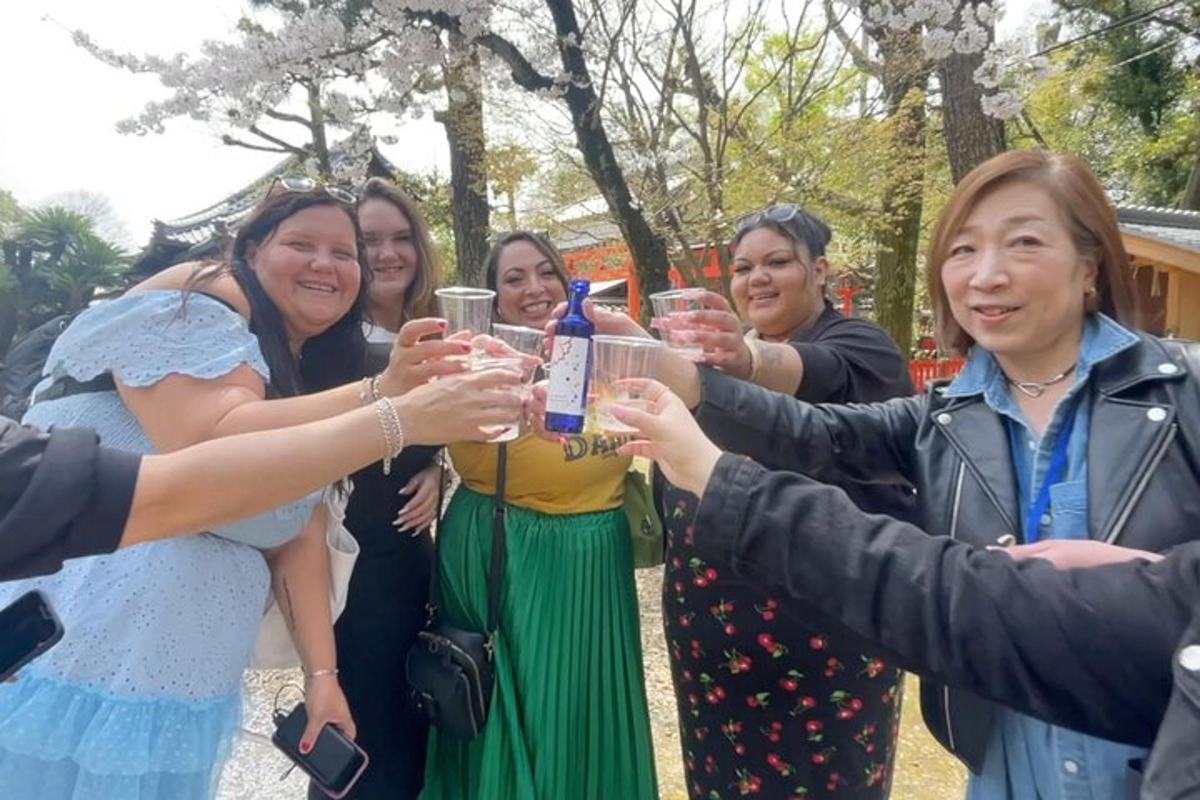 a group of women holding up glasses of wine