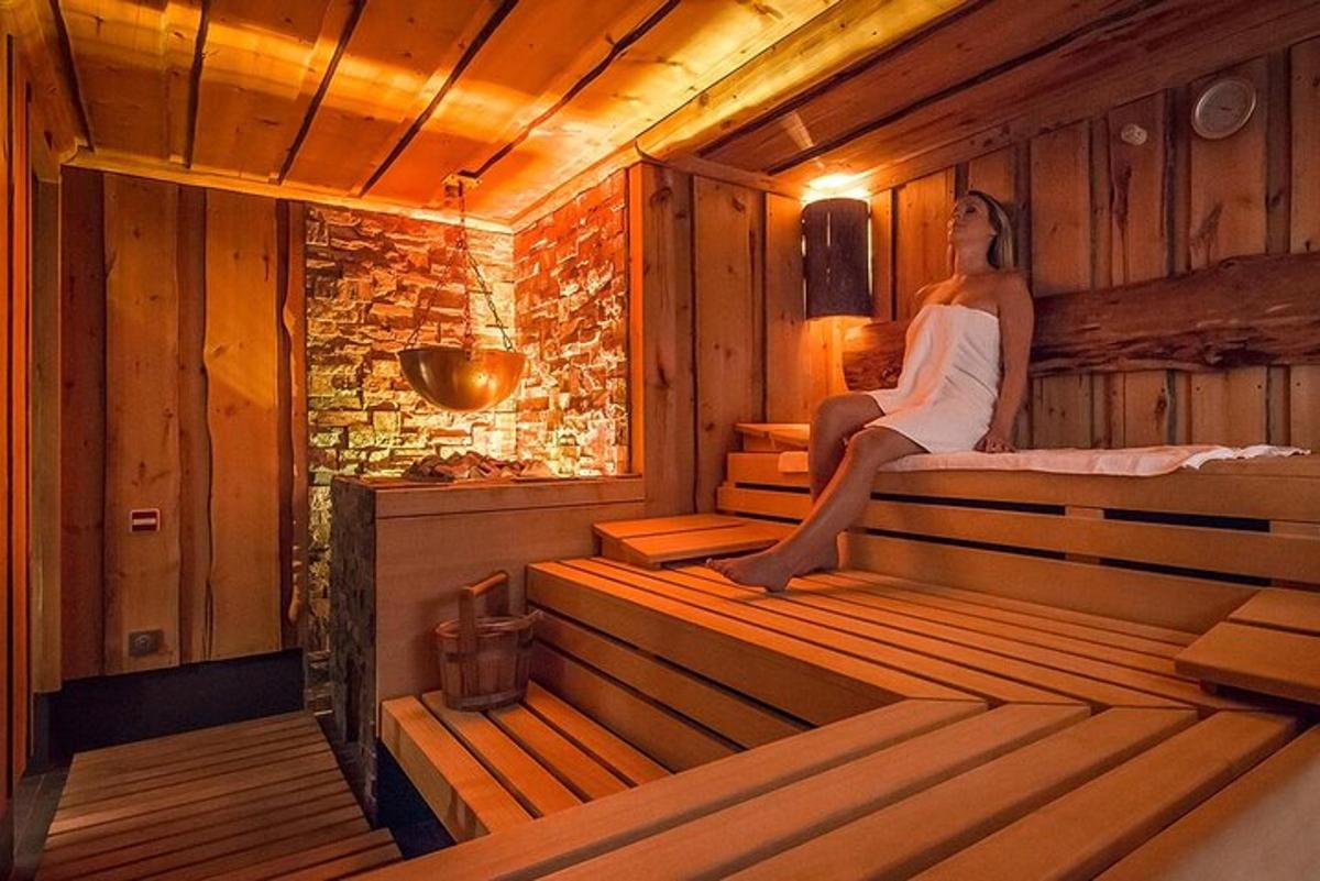a woman is sitting in a sauna