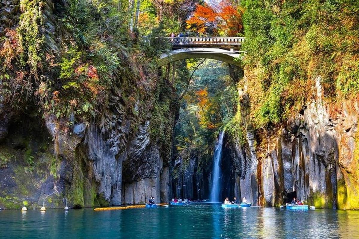 a bridge over a body of water with a waterfall