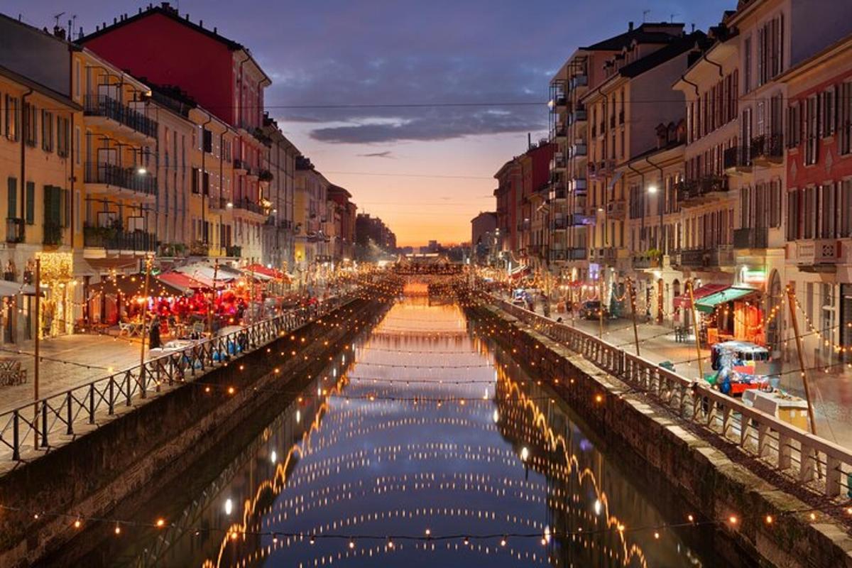 a canal in a city at night with lights