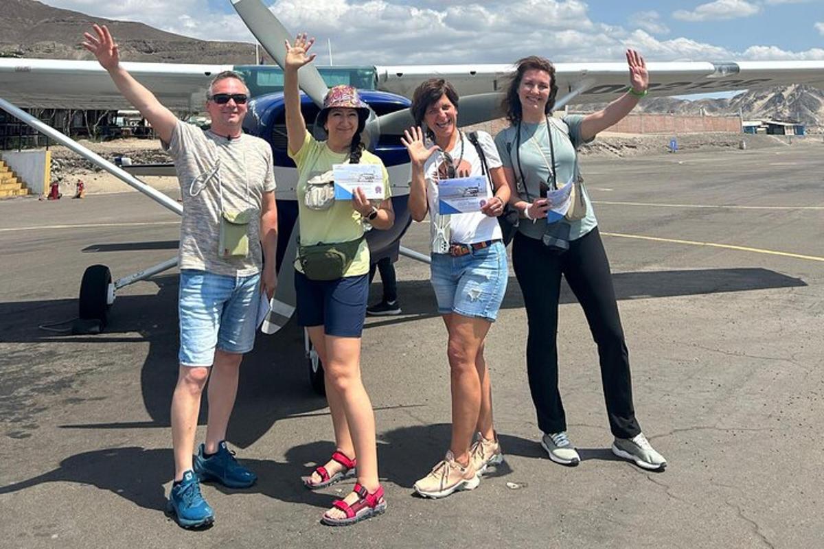 a group of people standing in front of a plane