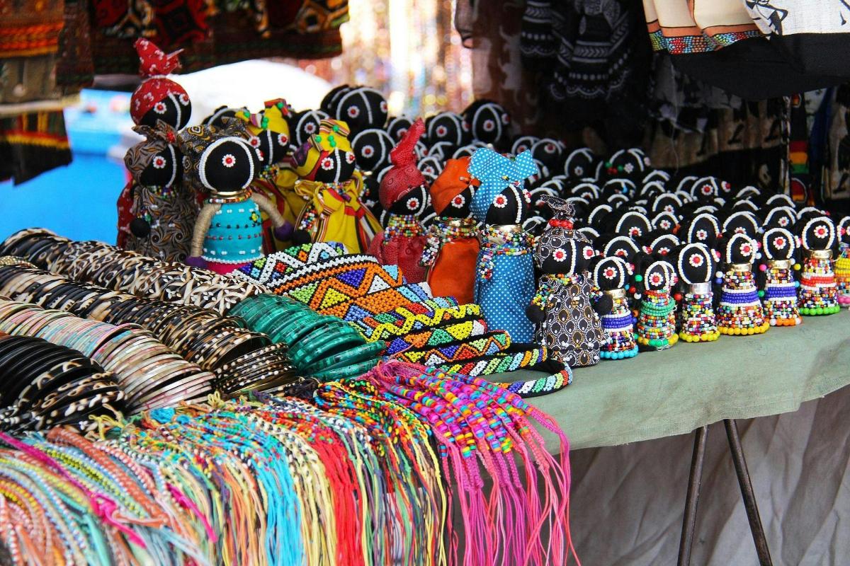 a table filled with lots of different colored bangles