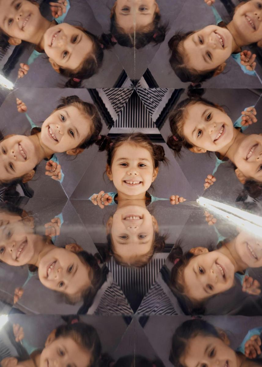 a group of children standing in a circle
