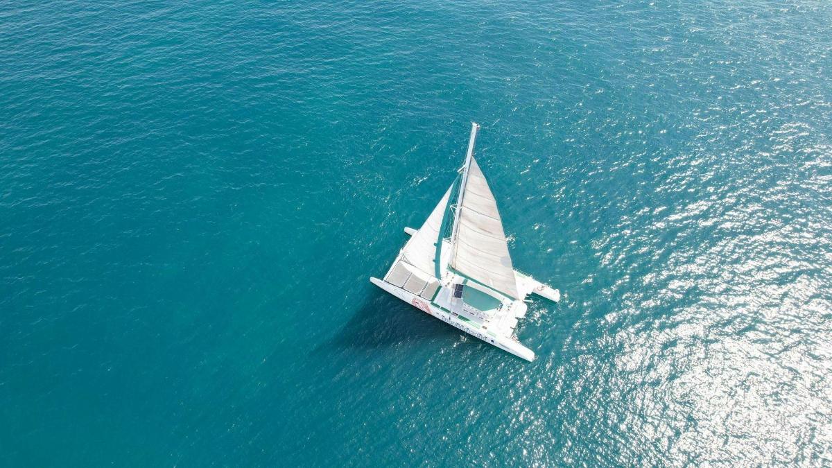a white sailboat in the middle of the water