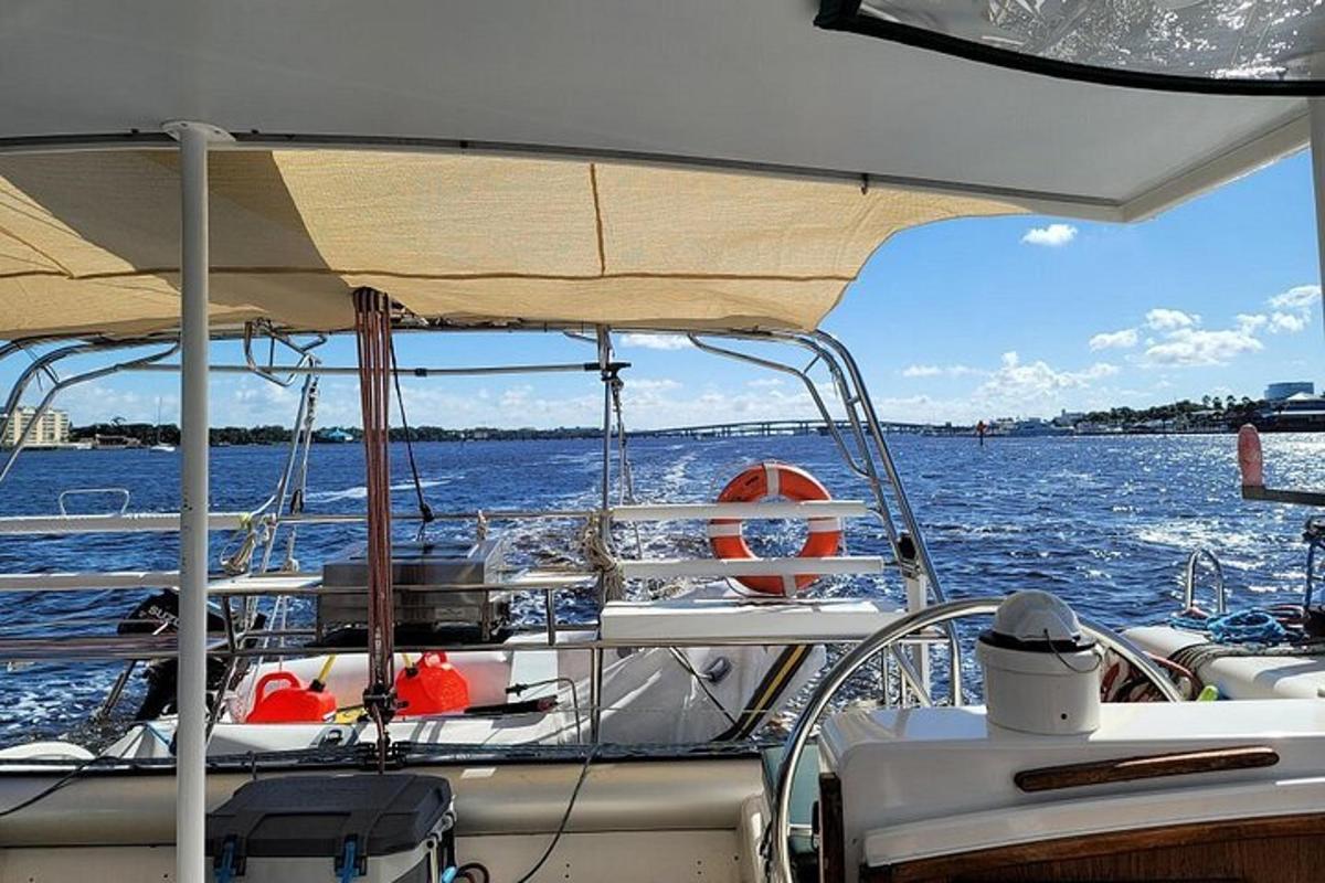 a boat with an umbrella on a body of water