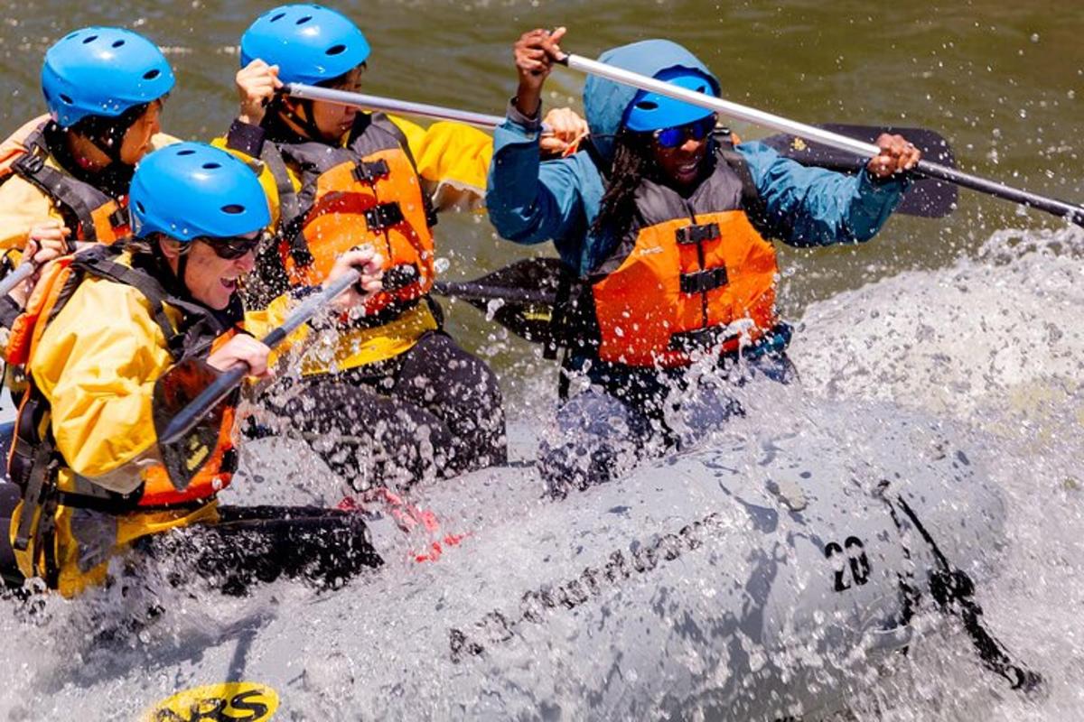 a group of people rafting in a river