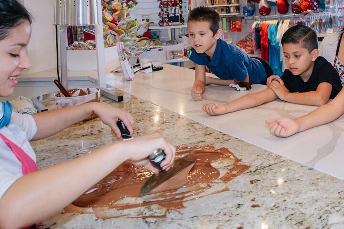a group of children laying on the counter playing with chocolate