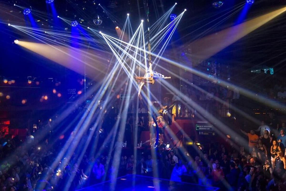 a stage with lights and a crowd of people