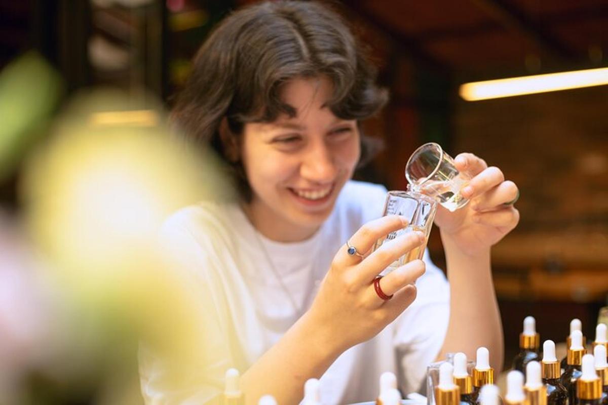 a woman is holding a glass of wine