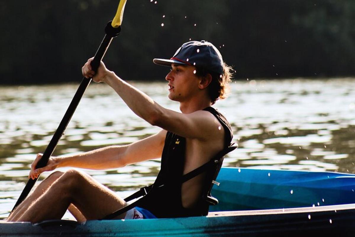 a man sitting in a kayak on the water