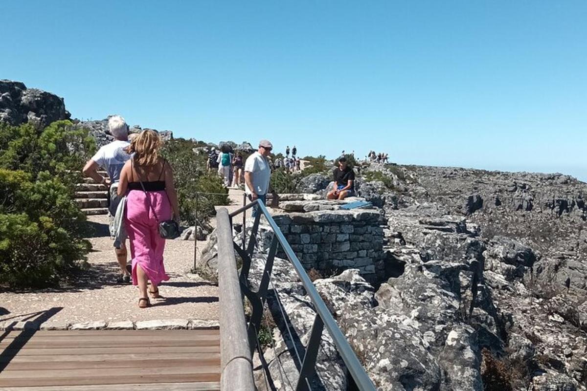 a group of people walking down a wooden stairs