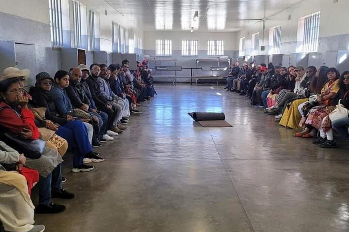 a large group of people sitting in a room
