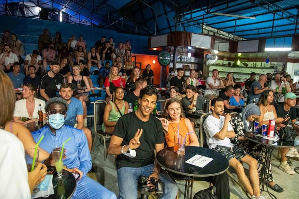 a group of people sitting in front of a crowd