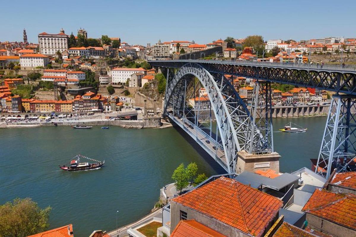 a bridge over a river with a boat in the water