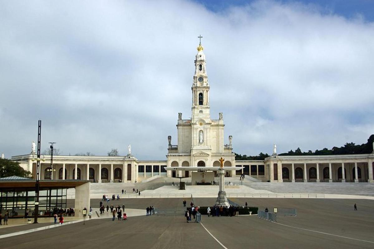 a large building with a clock tower in front of it