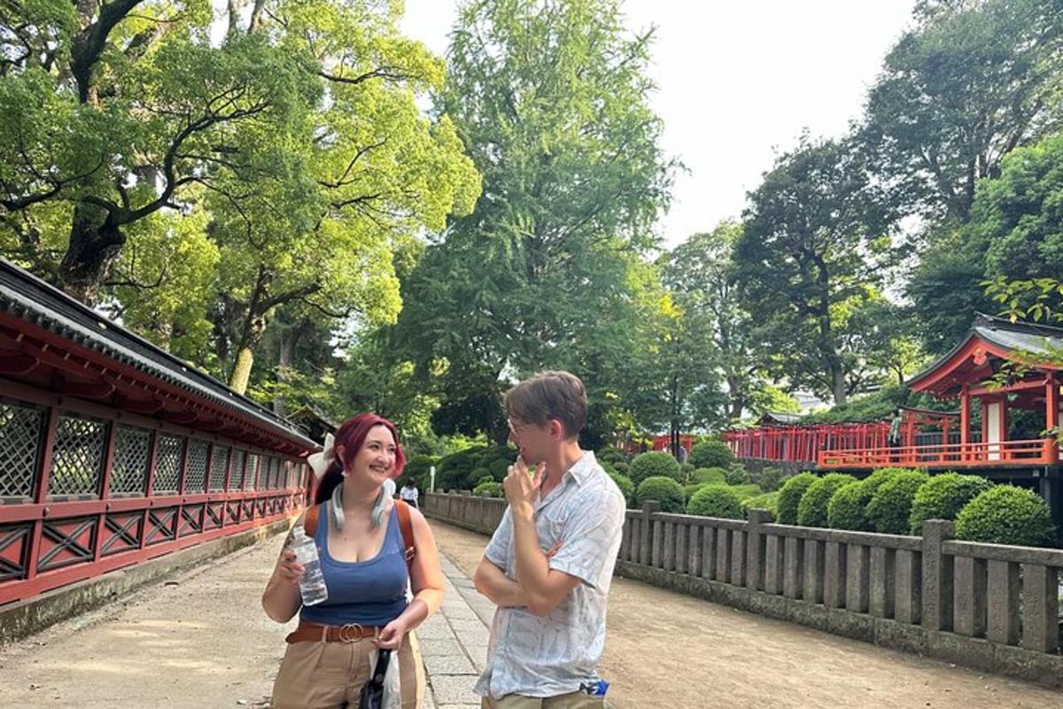 a man and a woman standing next to a bridge