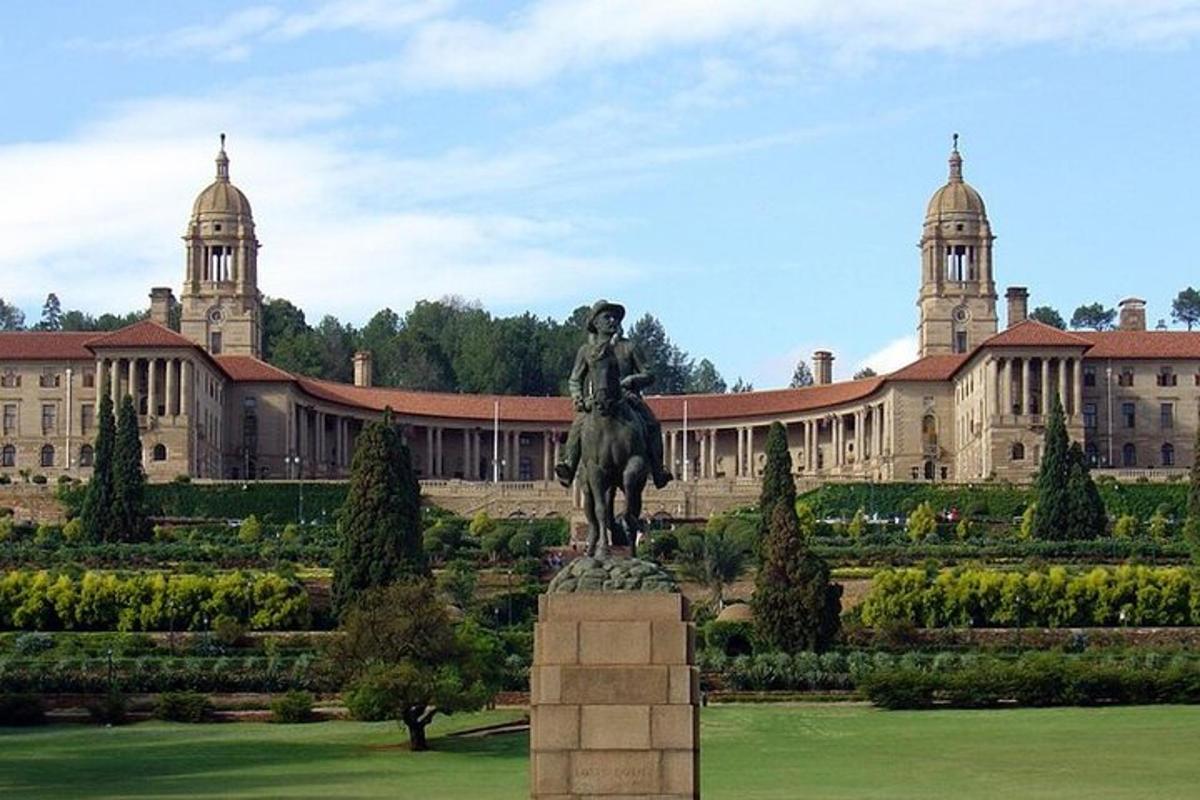 a statue of a man on a horse in front of a building