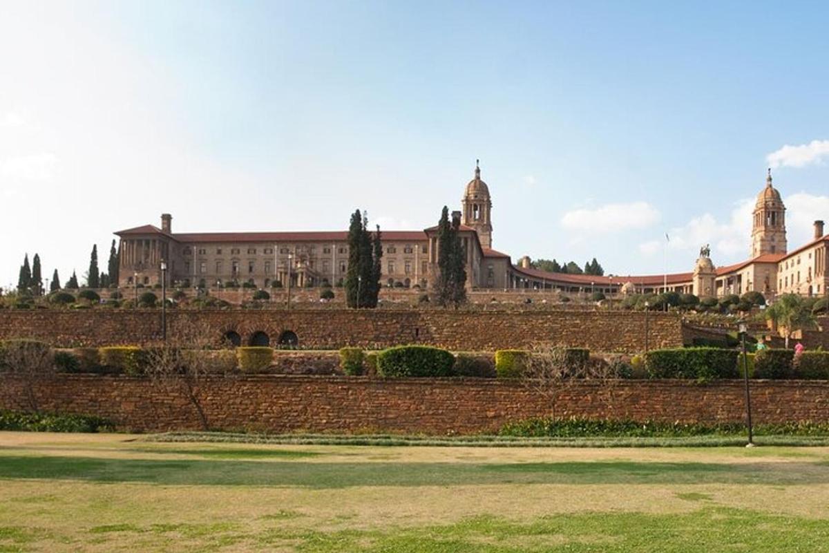 a large building in front of a brick wall