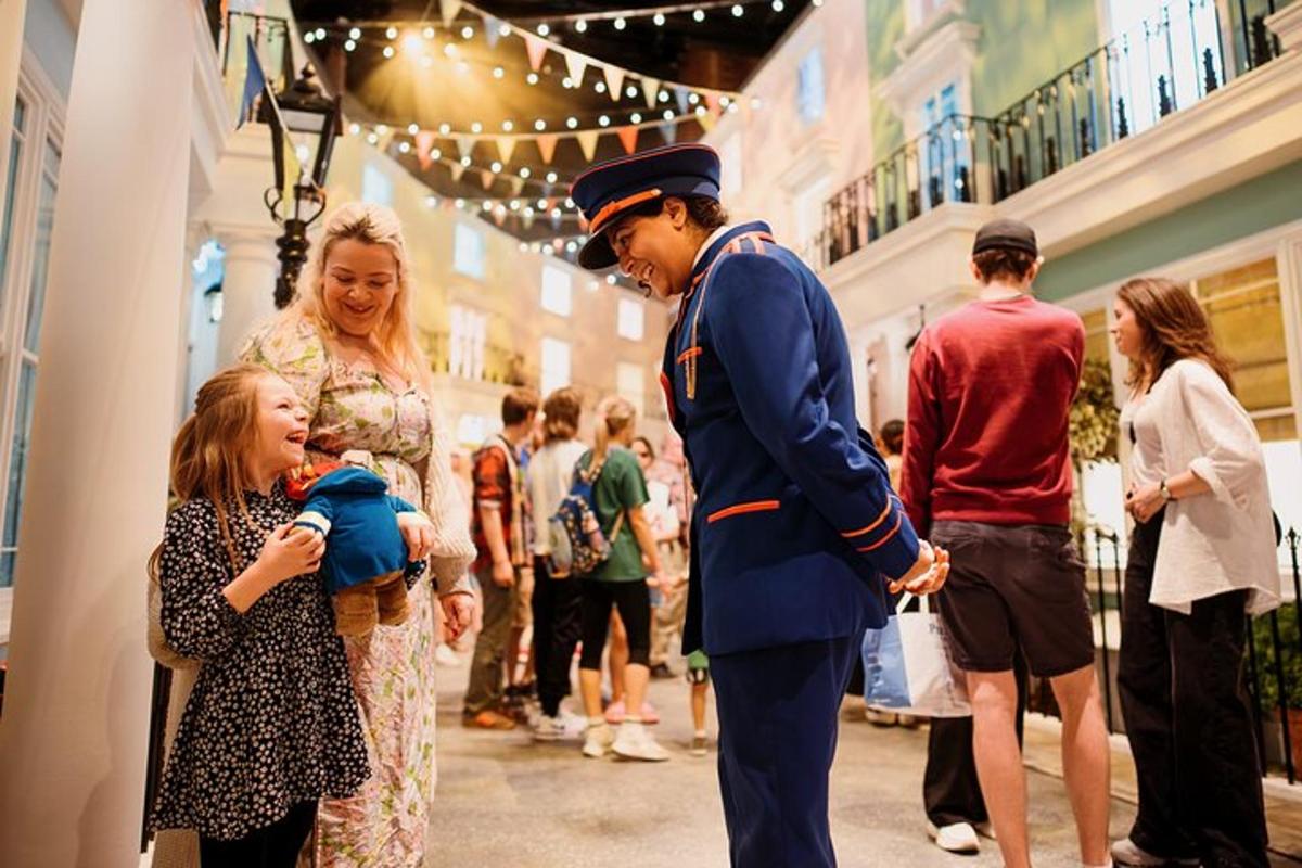 a man in a uniform is talking to a little girl