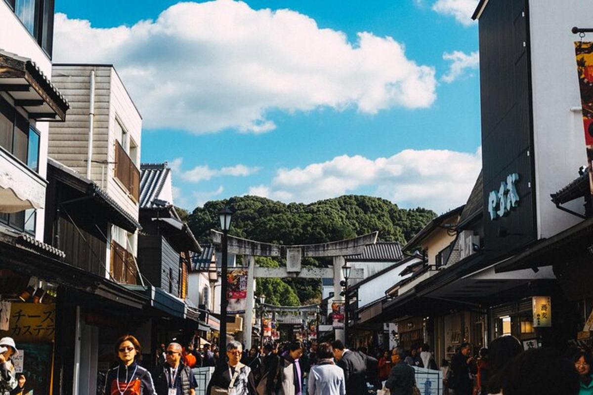 a crowd of people walking down a busy street