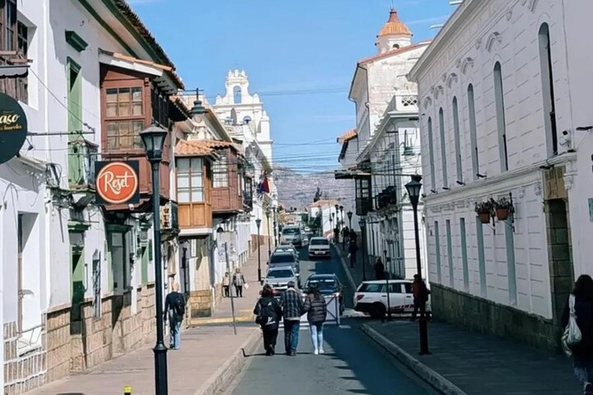a group of people walking down a city street