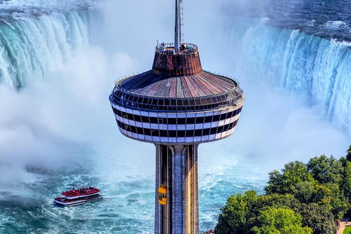 a control tower in front of a waterfall