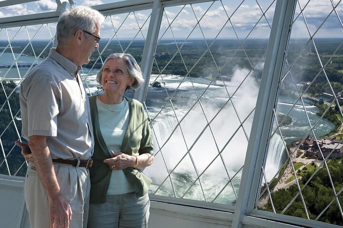 a man and a woman standing in front of a window
