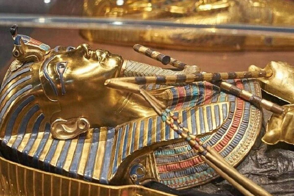 a gold elephant statuette of a golden horse