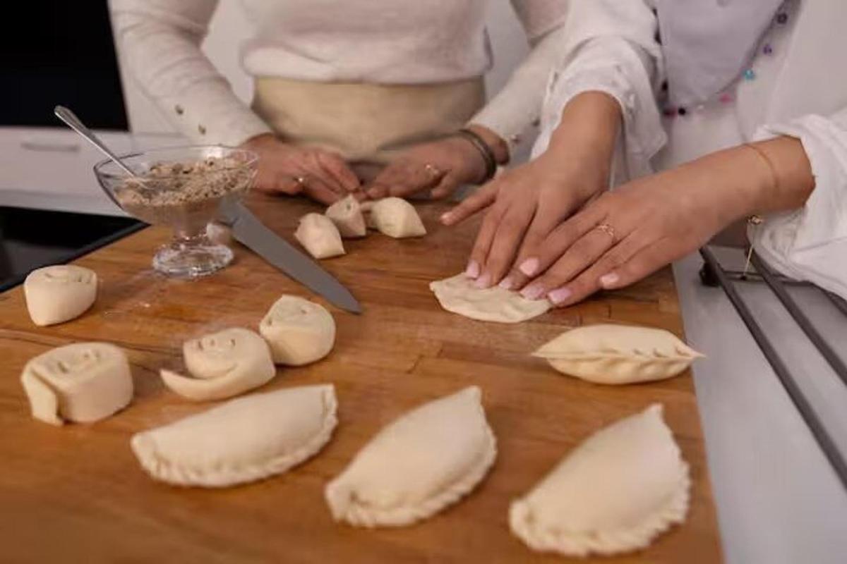 a woman is preparing food on a cutting board