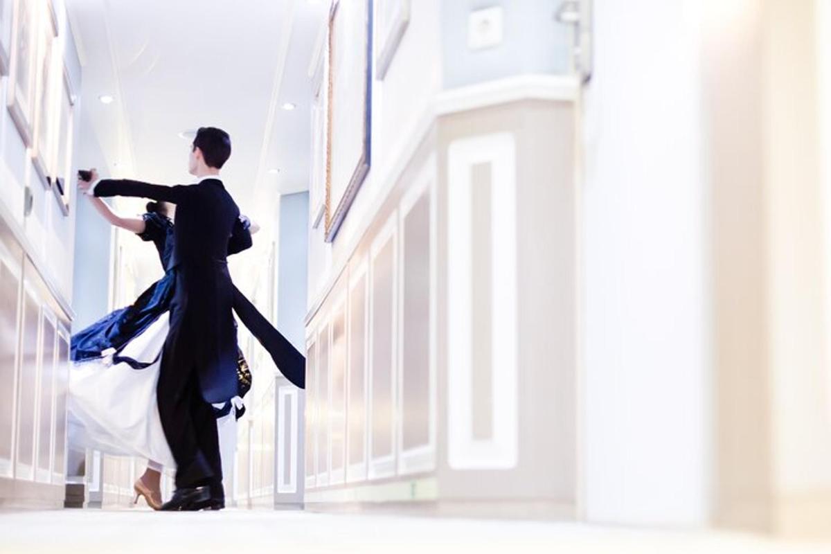a man and a woman dancing in a building