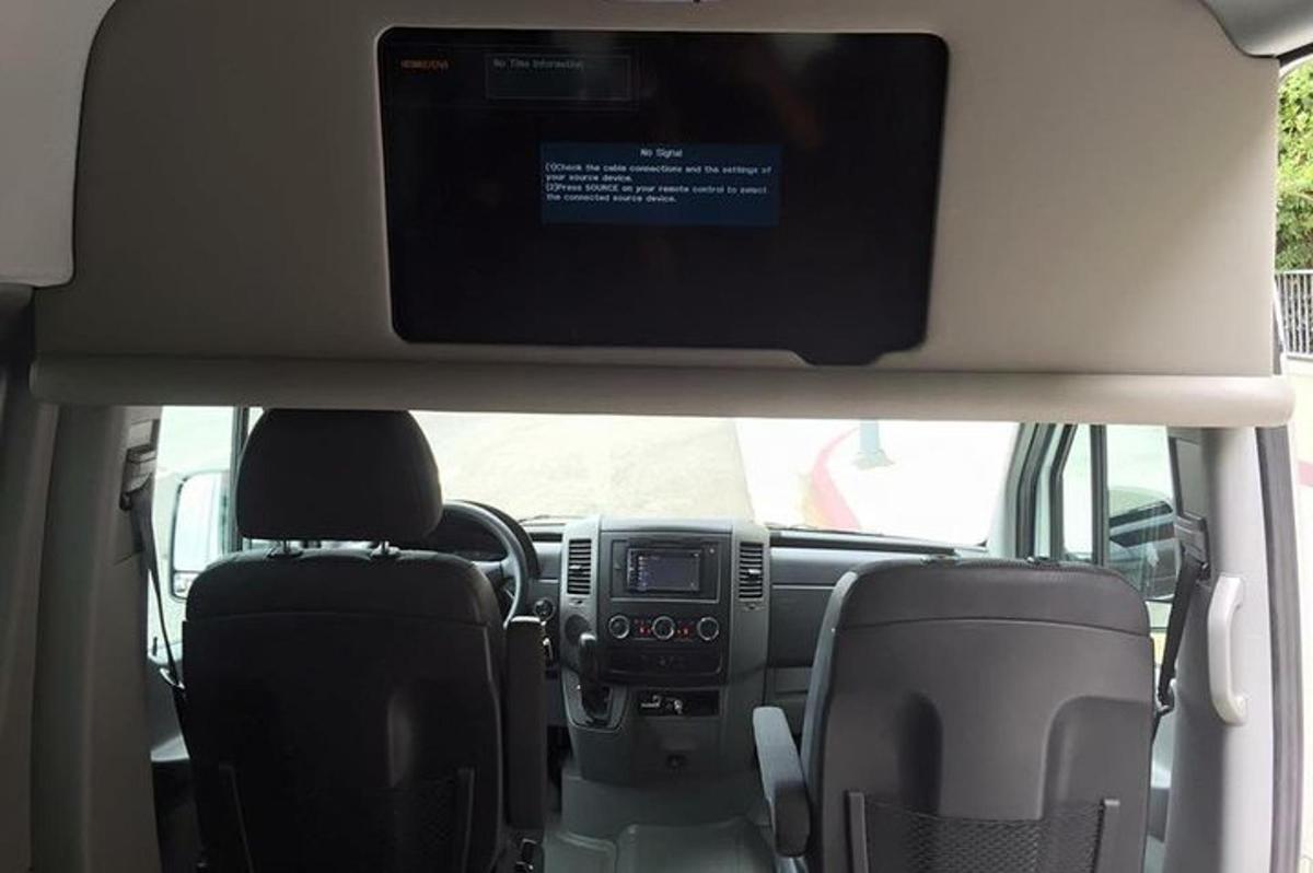 a view of the dashboard of a car with a television