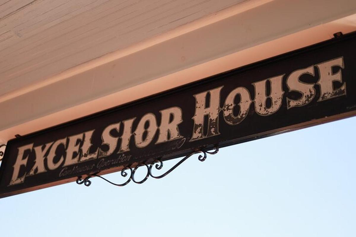 a street sign hanging from the side of a building