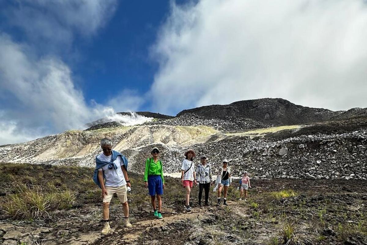 a group of people walking on a mountain