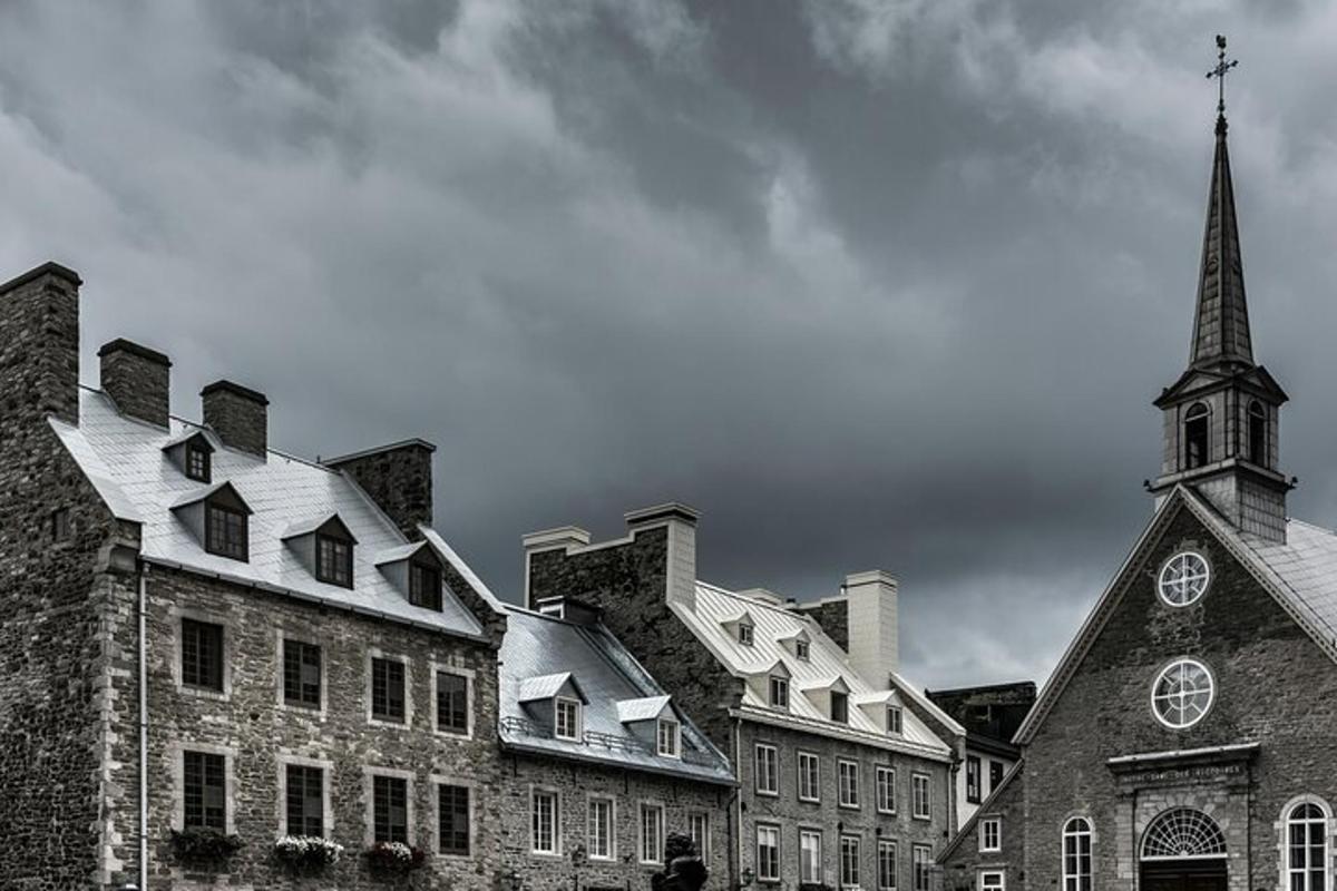a black and white photo of a building with a church