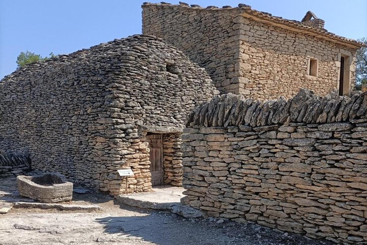 an old stone building with a stone wall