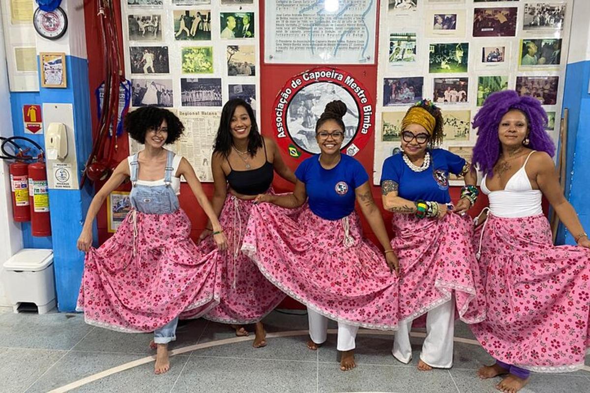 a group of women posing for a picture in a room