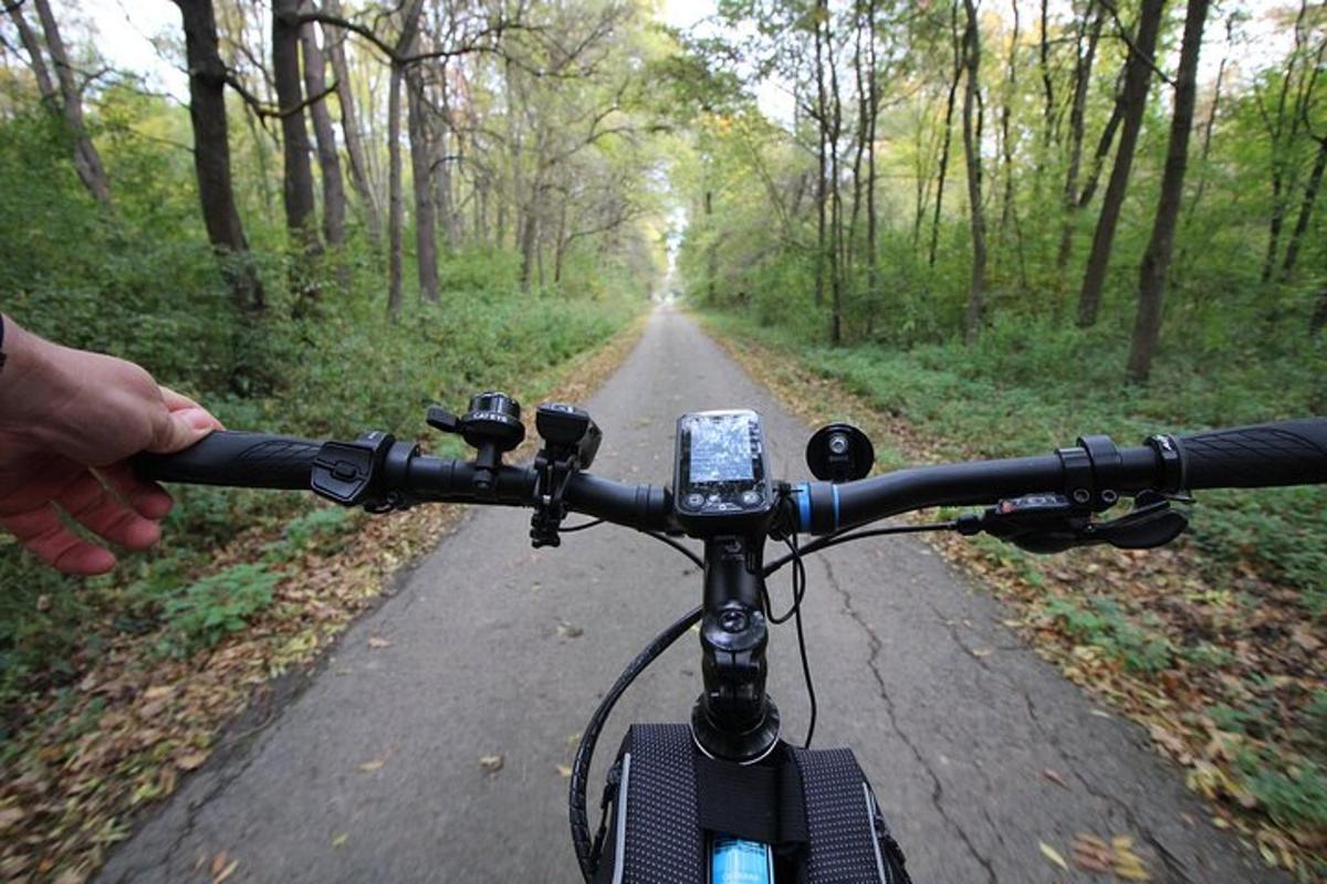 a person riding a bike on a dirt road