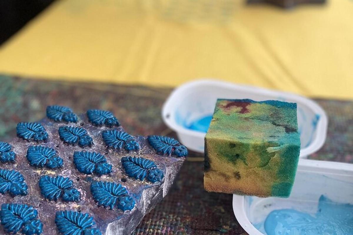 a piece of cake and a container of blue frosting