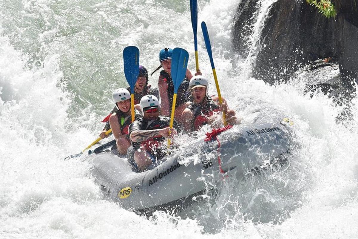 a group of people on a raft in a river
