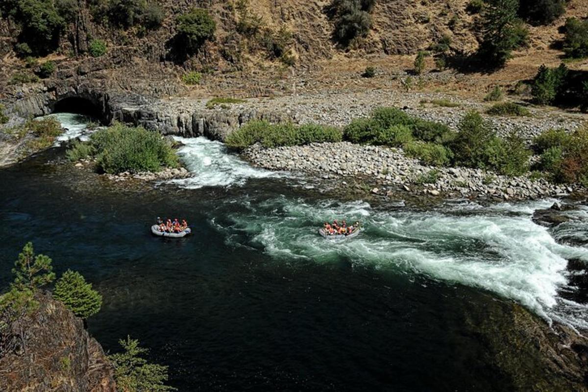 a group of people in boats in a river