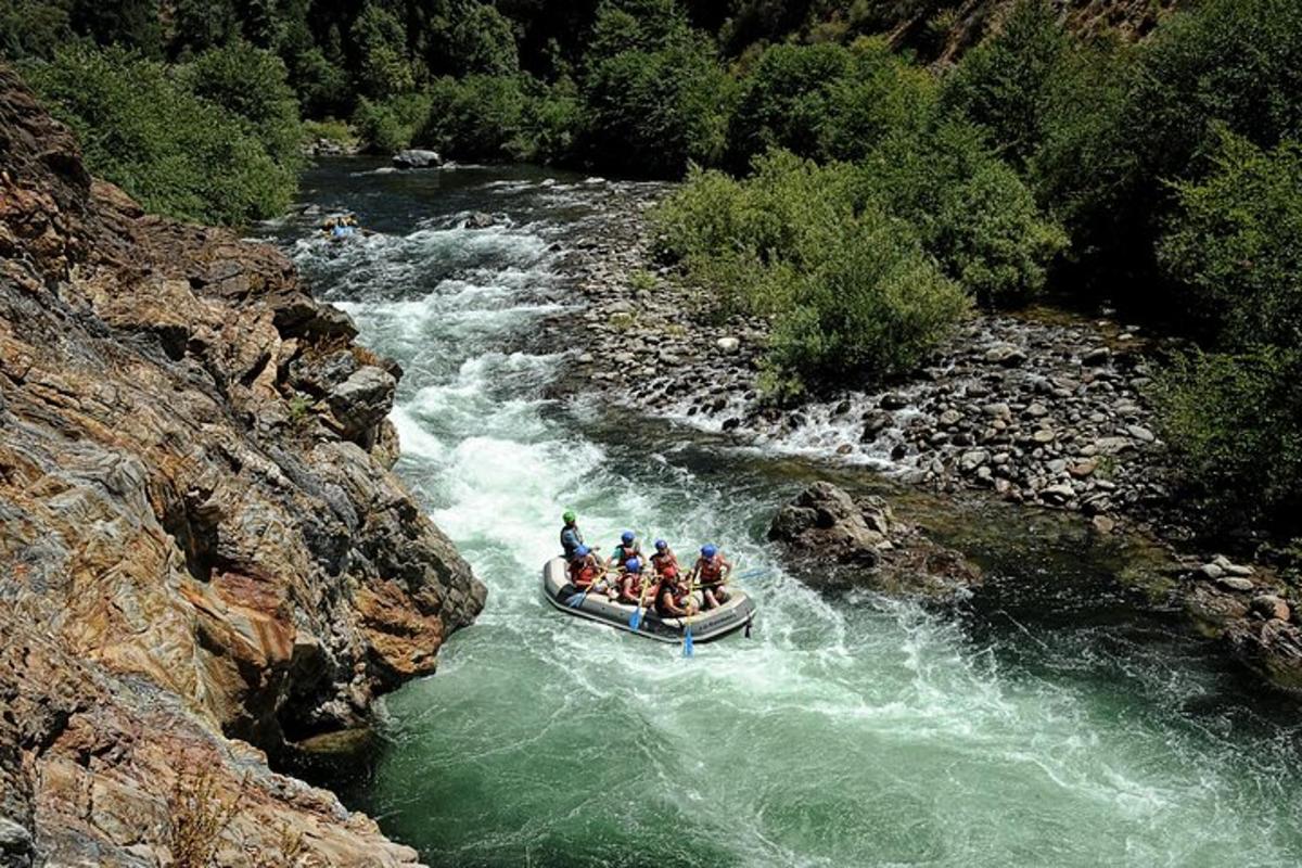 a group of people in a raft in a river