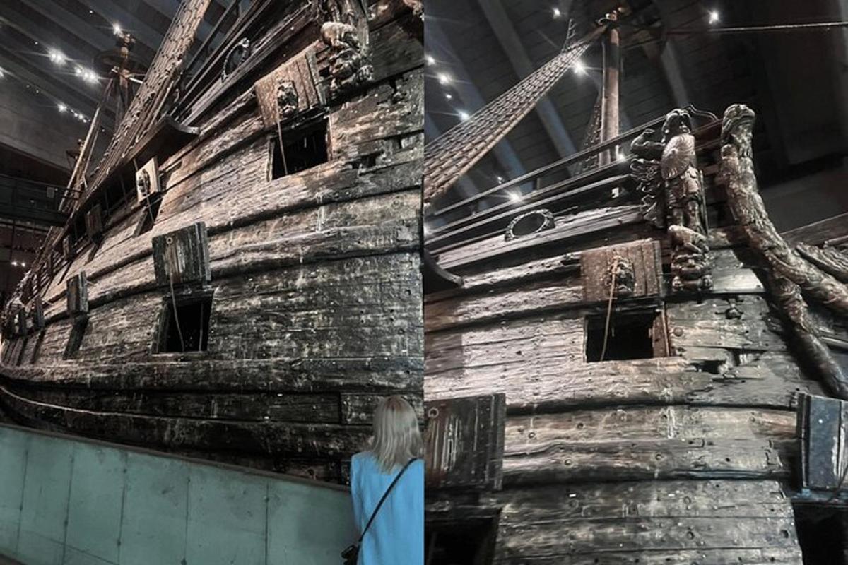 a woman standing in front of an old ship