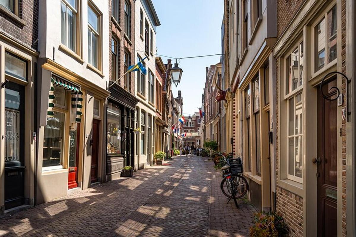 an alley with buildings and a bike on a street