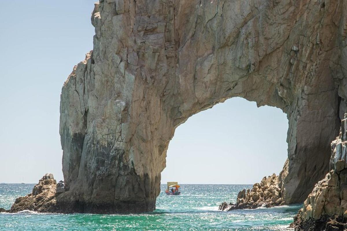 an arch in a rock formation in the ocean