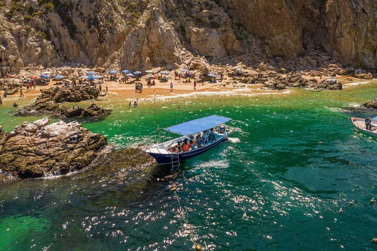 a group of people in a boat on a beach