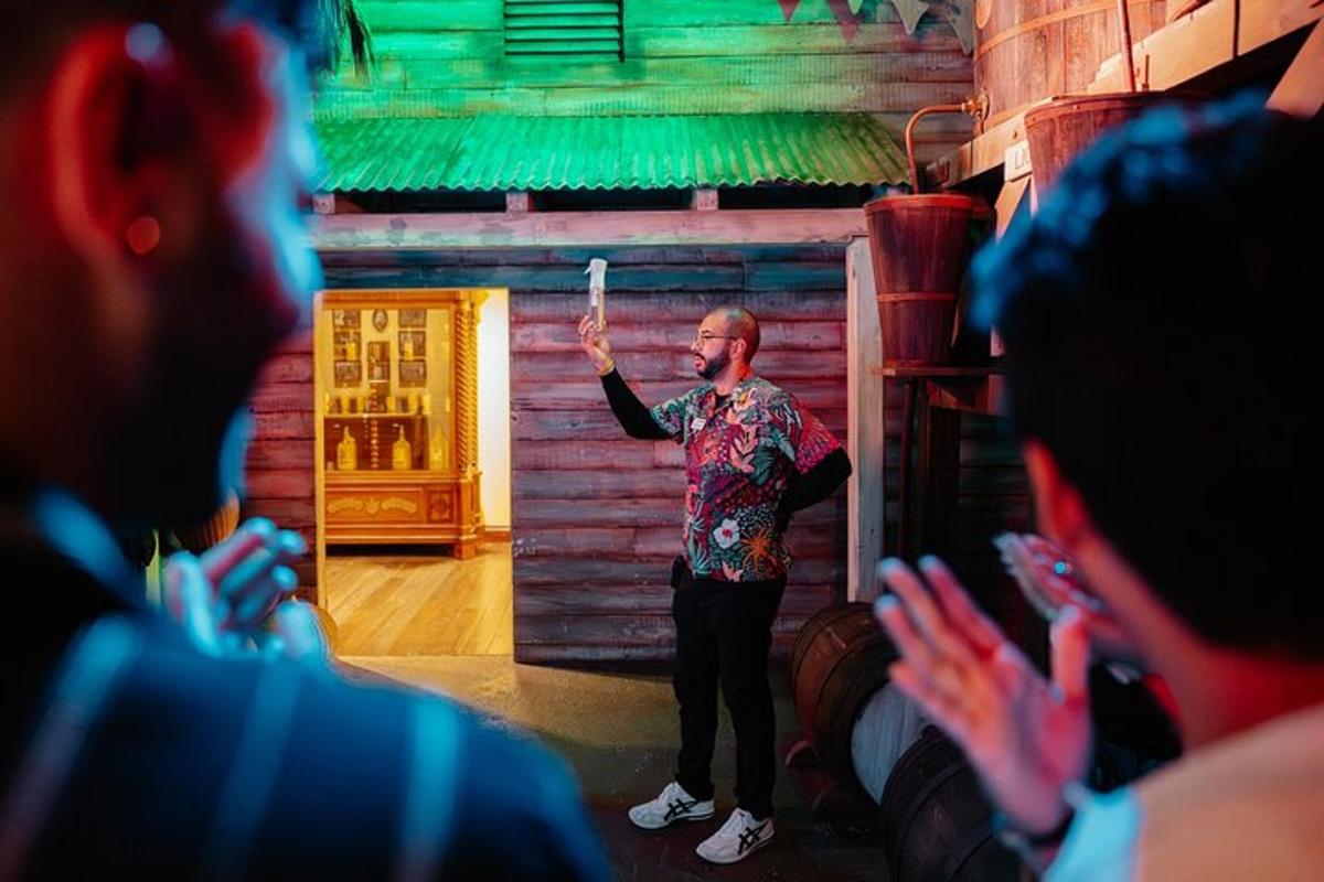 a man standing on a stage in front of a group of people