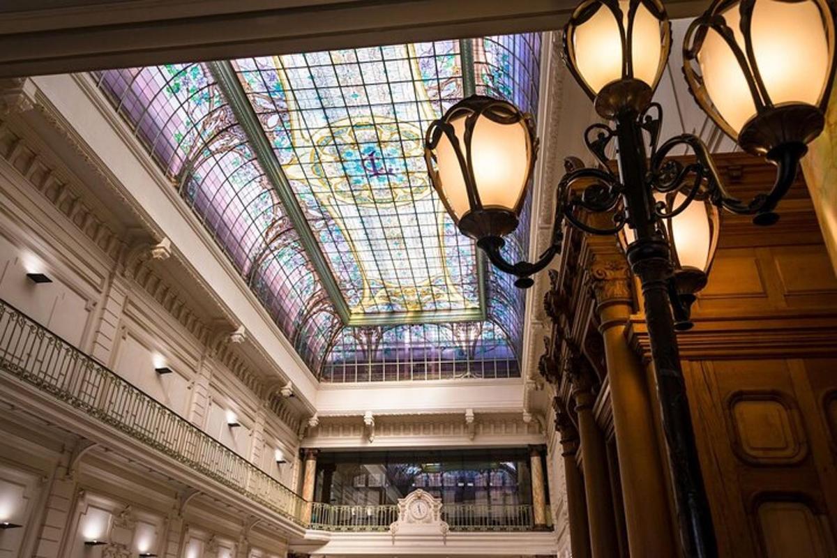 a building with a ceiling with a stained glass window