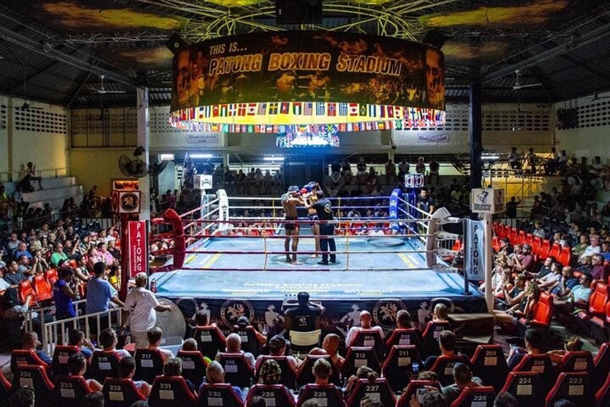 a crowd of people watching a boxing match