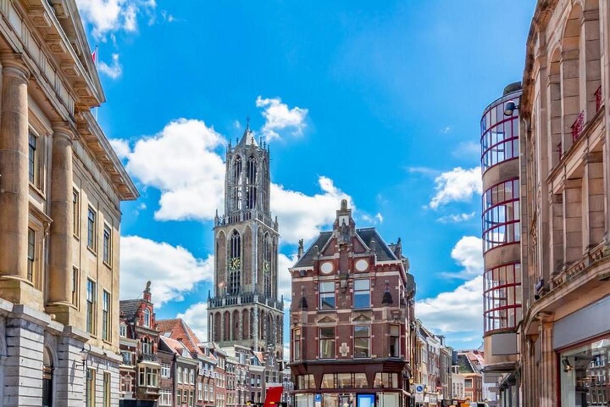a city street with two tall buildings and a clock tower